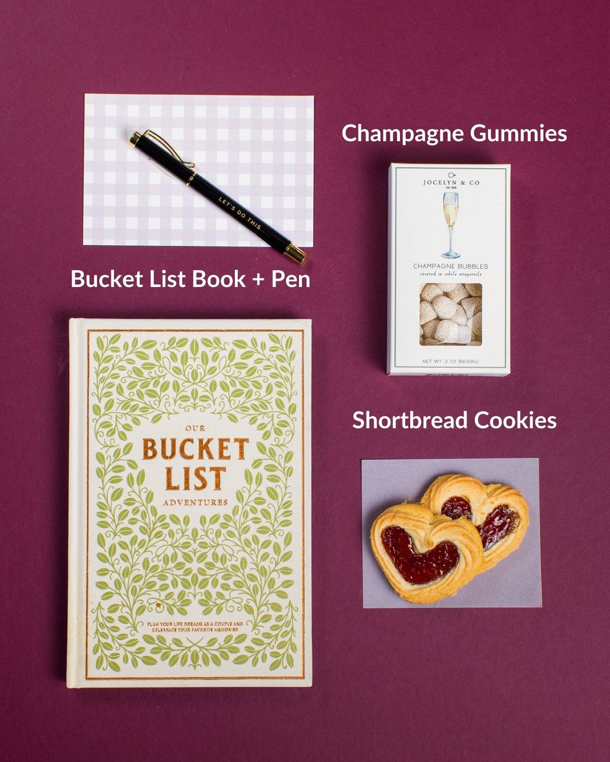 Adventures for Two set featuring a bucket list book, pen, champagne gummies, and shortbread cookies.