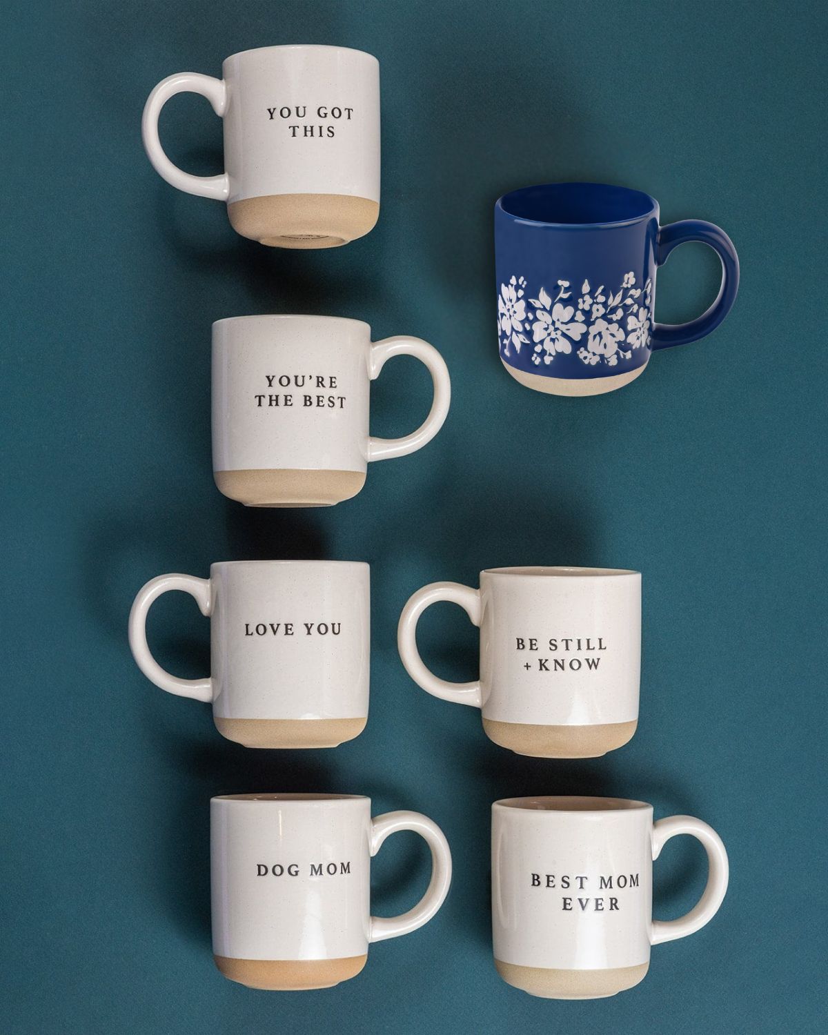 Afternoon Tea mugs in white with various messages, featuring a blue floral design mug.