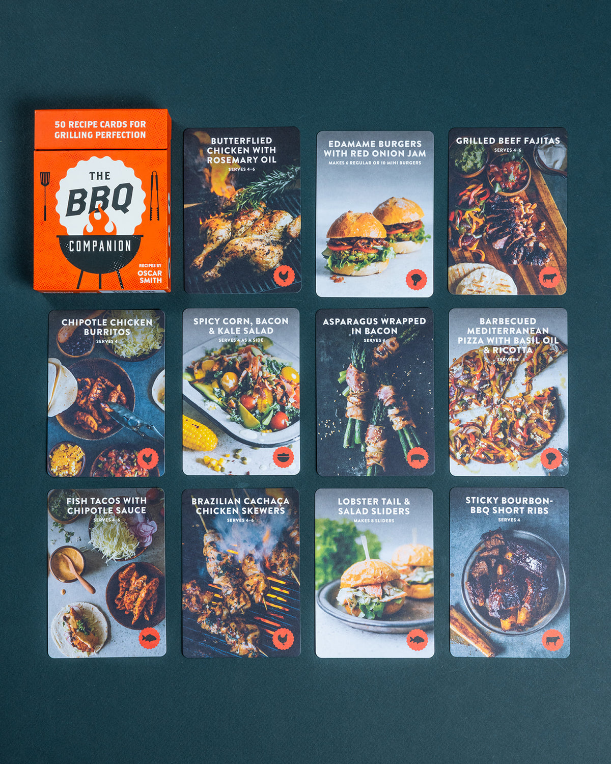 The BBQ Companion recipe card set with an orange box and ten illustrated grilling recipe cards arranged on a dark background.