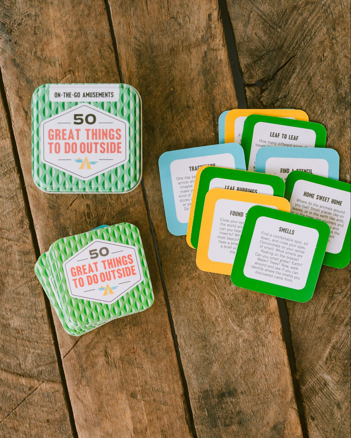 Get Outside activity set with a green patterned tin and colorful square cards featuring outdoor adventure prompts.