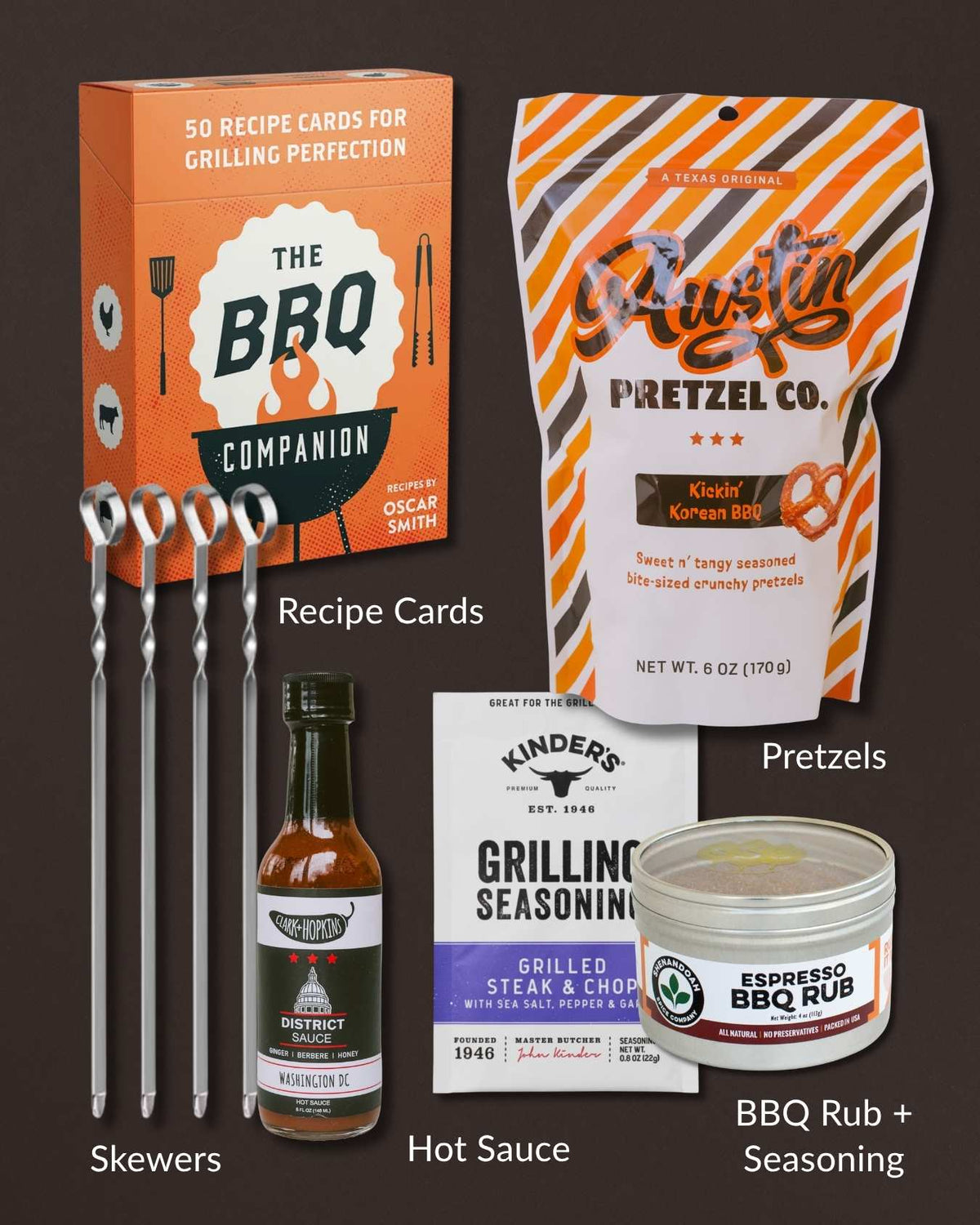 Grill Time gift set featuring stainless steel skewers, BBQ rub, grilling seasoning, hot sauce, recipe cards, and BBQ pretzels.