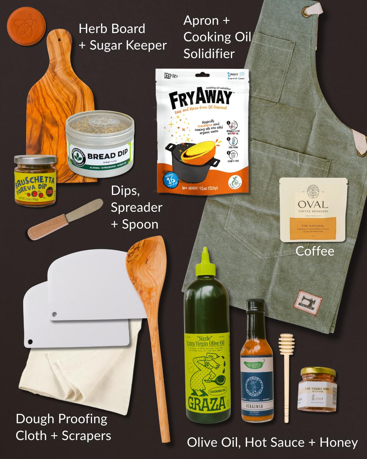 Kitchen gift set featuring an olive wood board, green apron, olive oil, hot sauce, honey, coffee, and cooking essentials.