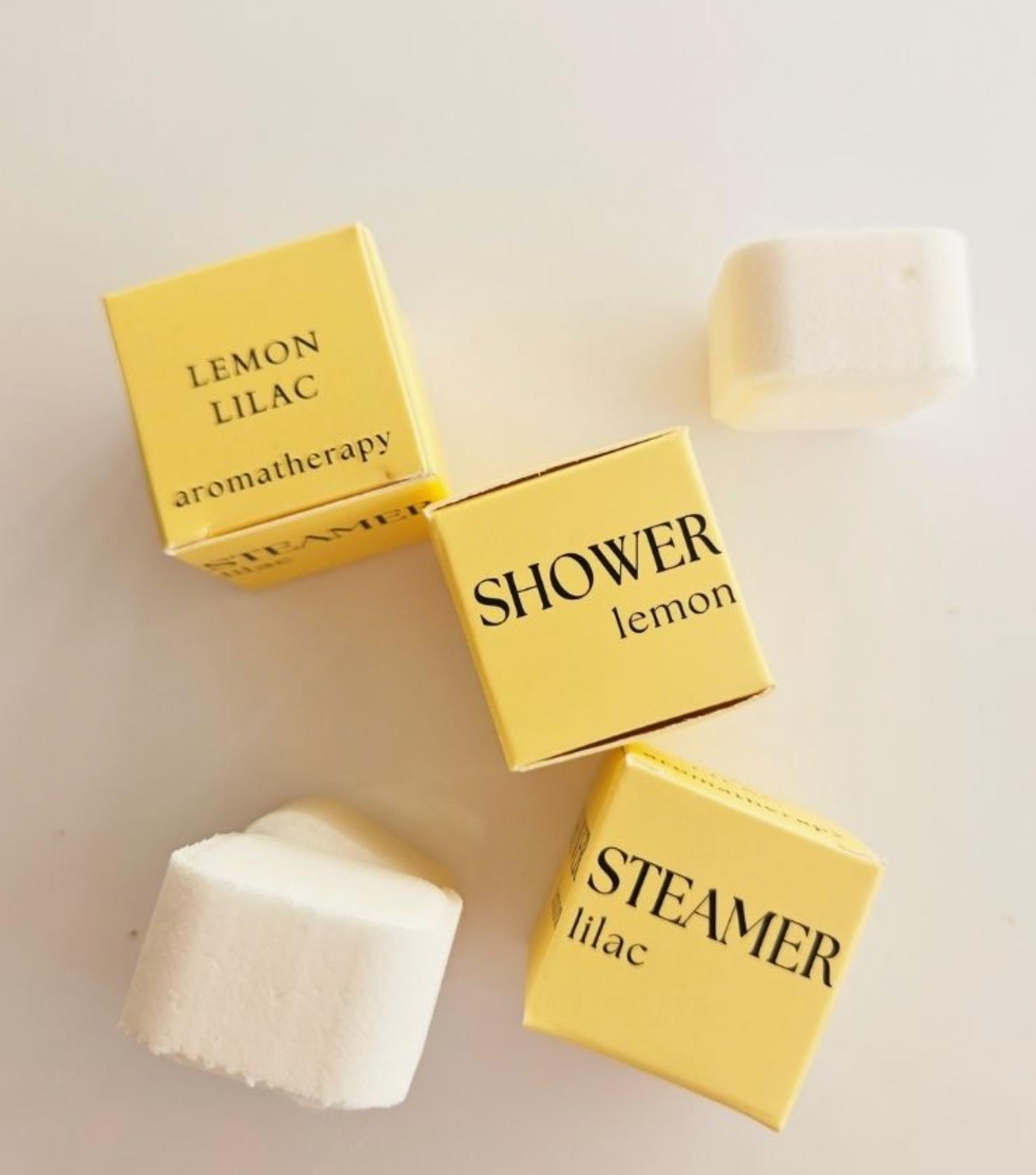 Mini Spa Day with yellow aromatherapy shower steamers in lemon and lilac scents.