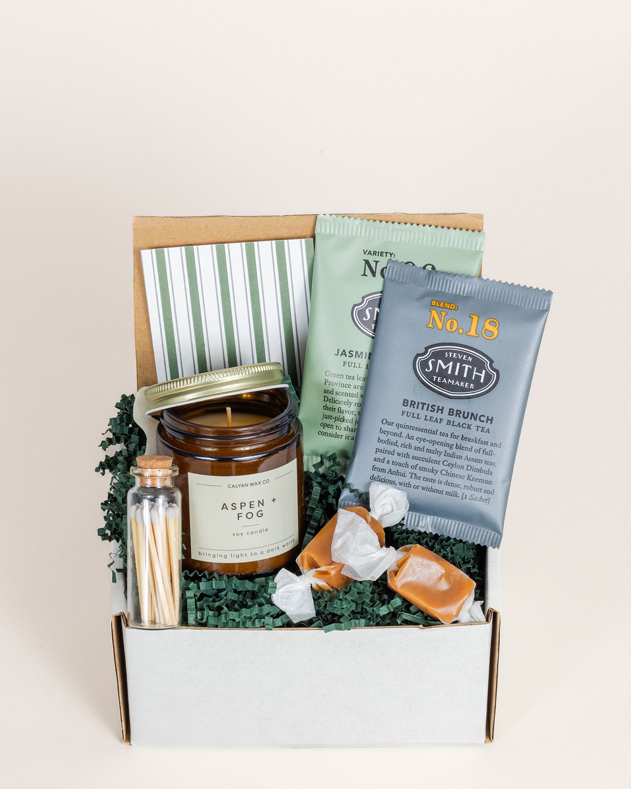 Friendly Hello gift box featuring Aspeng Fog candle, tea, and caramel candies in a decorative package.