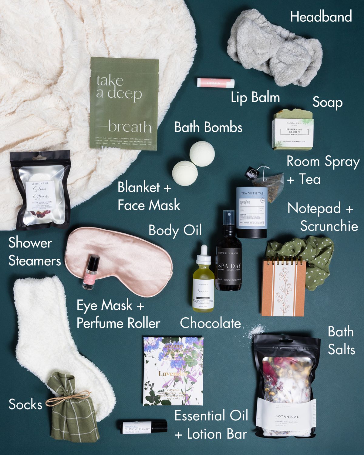 Ultimate Spa Day gift set featuring a plush faux fur blanket, bath bombs, skincare, tea, and chocolate on a dark green background.