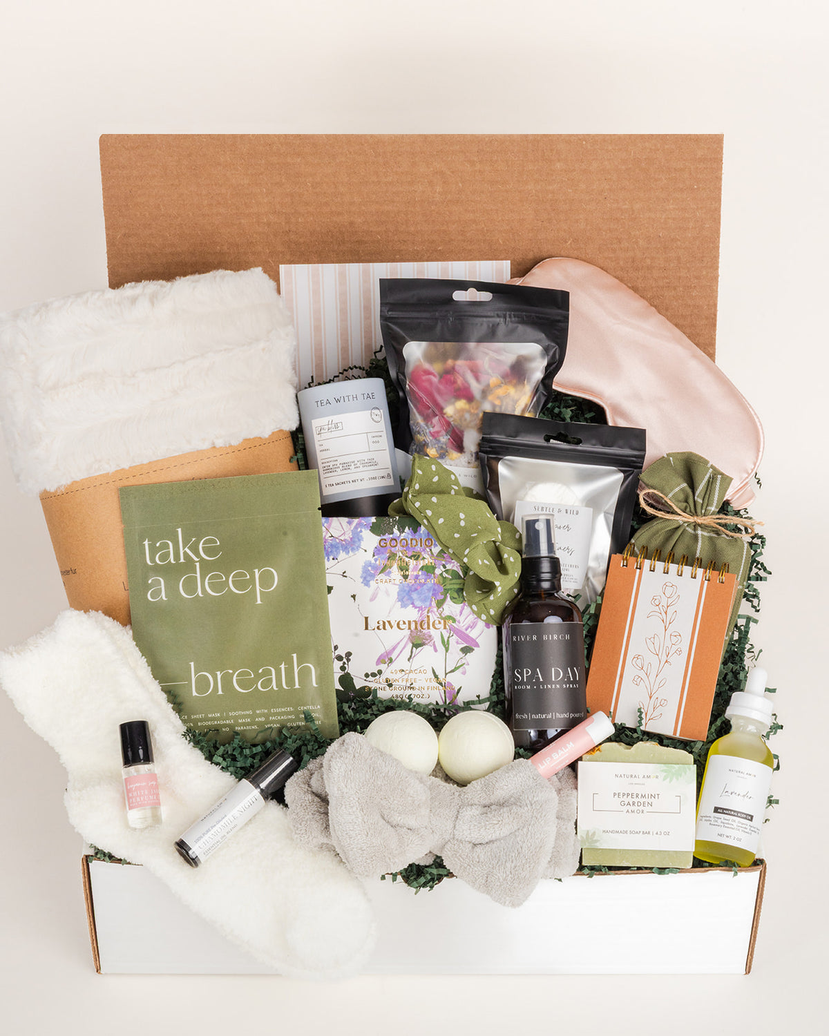 Ultimate Spa Day gift box featuring a faux fur blanket, silk eye mask, bath bombs, skincare, essential oils, and tea in a box.
