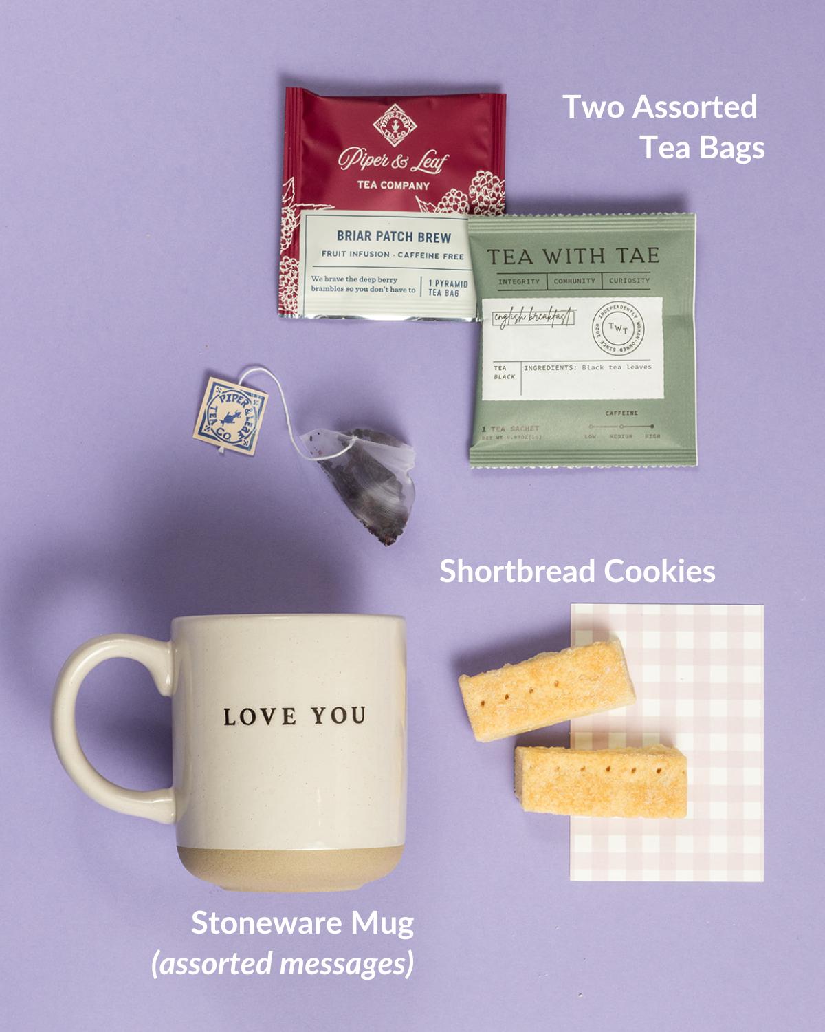 Mugful of Delight with stoneware mug, assorted tea bags, and shortbread cookies on a light background.